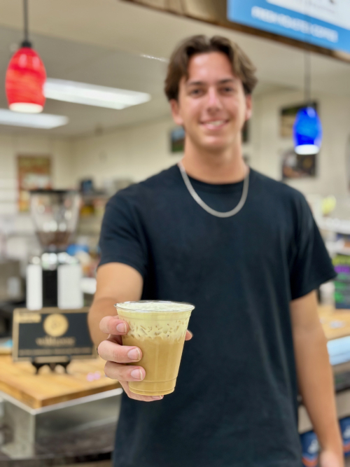 Man Holding iced coffee drink